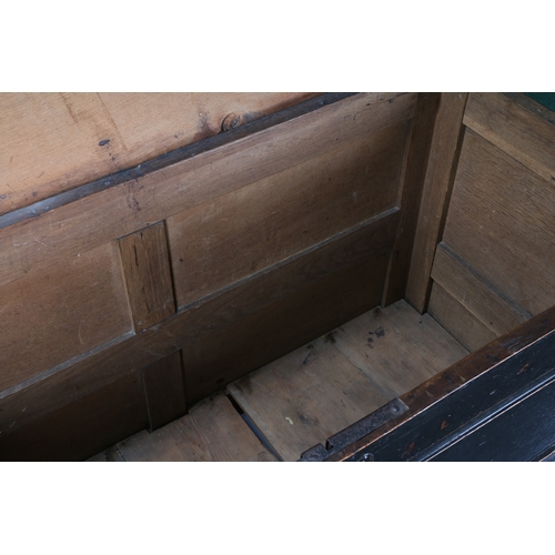 169 - AN 18TH CENTURY OAK CHEST. the rectangular top above three locks and four panels to the front, 136cm... 