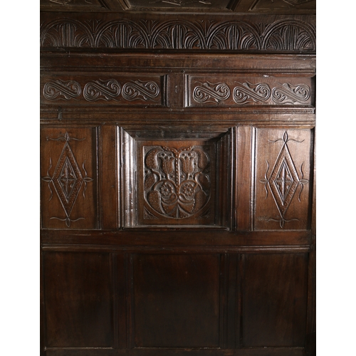 170 - CHARLES II OAK TESTER BED, LANCASHIRE, CIRCA 1670 AND LATER. Having a nine carved-panelled canopy, t... 