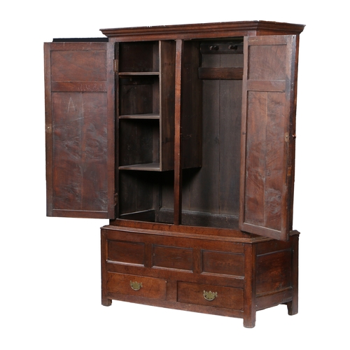 171 - AN OAK LIVERY CUPBOARD, ENGLISH, CIRCA 1700-30. Having a cyma-recta cornice, and a pair of doors wit... 