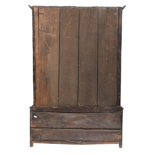 171 - AN OAK LIVERY CUPBOARD, ENGLISH, CIRCA 1700-30. Having a cyma-recta cornice, and a pair of doors wit... 