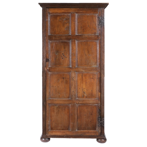 172 - AN OAK LIVERY CUPBOARD. Constructed from 17th/18th century panelling, having a single eight-panelled... 