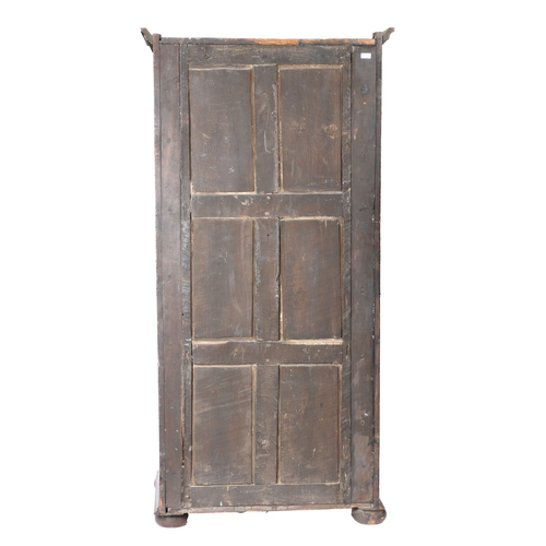 172 - AN OAK LIVERY CUPBOARD. Constructed from 17th/18th century panelling, having a single eight-panelled... 