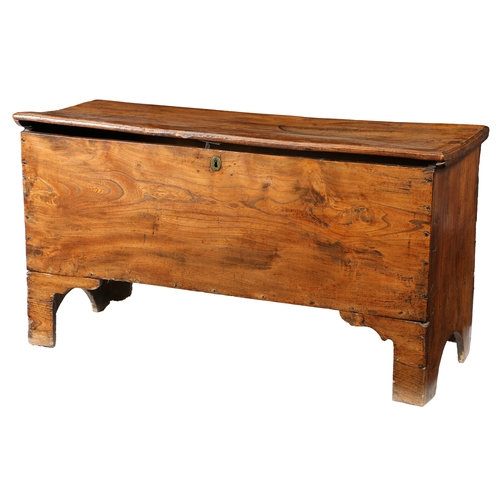 173 - AN EARLY 18TH CENTURY ELM BOARDED CHEST. The one-piece lid with moulded edge, the sides descending t... 