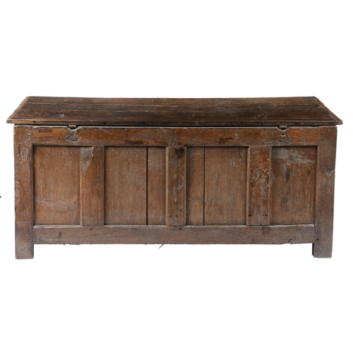 174 - A CHARLES II OAK COFFER, WESTMORLAND, CIRCA 1660. Having an end-cleated boarded hinged lid, the fron... 