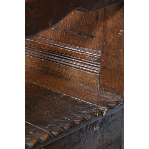 175 - A CHARLES II OAK AND INLAID OPEN ARMCHAIR, YORKSHIRE, CIRCA 1670. The back panel carved with a flowe... 