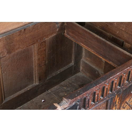 176 - A JAMES I OAK AND INLAID COFFER, CIRCA 1620. Having a quadruple-panelled lid, the front again with f... 