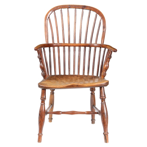 179 - A GEORGE III YEW WOOD AND ELM WINDSOR ARMCHAIR, CIRCA 1800. The arched top rail above spindles and a... 