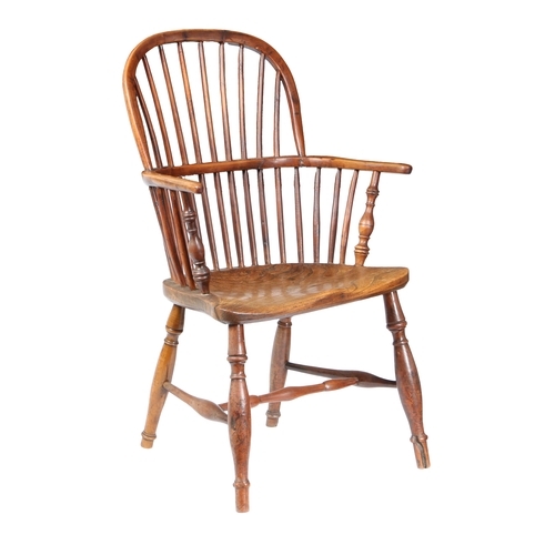 179 - A GEORGE III YEW WOOD AND ELM WINDSOR ARMCHAIR, CIRCA 1800. The arched top rail above spindles and a... 