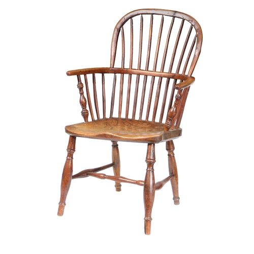 179 - A GEORGE III YEW WOOD AND ELM WINDSOR ARMCHAIR, CIRCA 1800. The arched top rail above spindles and a... 