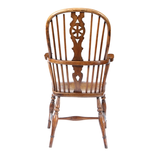 18 - A GEORGE III WINDSOR CHAIR, STAMPED PARMAN. with a arched back with a wheel and spindle back raised ... 