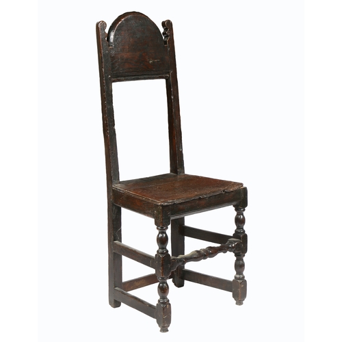 186 - A CHARLES II SLENDER OAK BACKSTOOL, YORKSHIRE, CIRCA 1670. The open back with deep arched cresting r... 