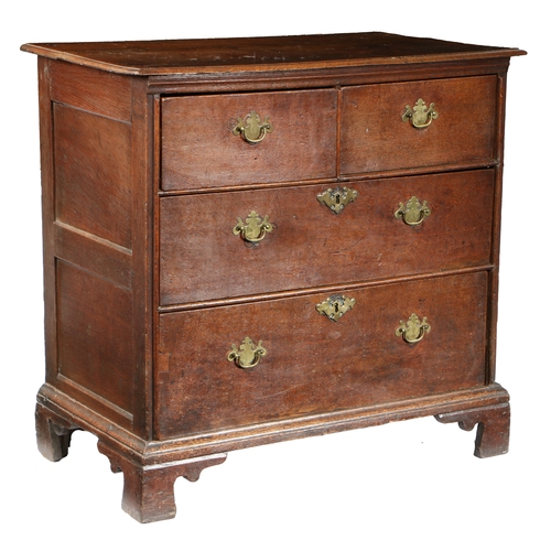 188 - A GEORGE II OAK CHEST OF DRAWERS, CIRCA 1740. The rectangular top above two short and two long drawe... 