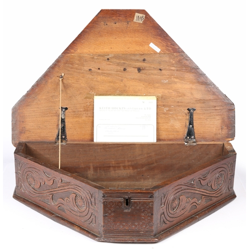 193 - A MID-17TH CENTURY OAK BOARDED TRIANGULAR-SHAPED BOX, ENGLISH, CIRCA 1640-60. The long sides leafy-s... 