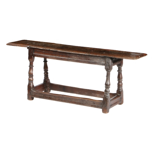 195 - A CHARLES II OAK FORM OR LONG BENCH, CIRCA 1660 AND LATER. The moulded rectangular top above channel... 