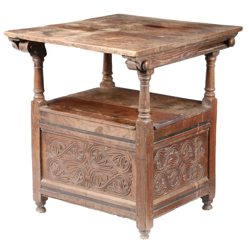 197 - A CHARLES II OAK TABLE-CHAIR, CIRCA 1670. With pivotal pegged plank top, on turned supports, the sea... 