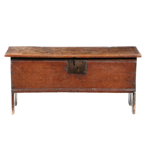 198 - A MID-17TH CENTURY OAK BOARDED CHEST, CIRCA 1630-60. Constructed from single-piece boards, the lid a... 