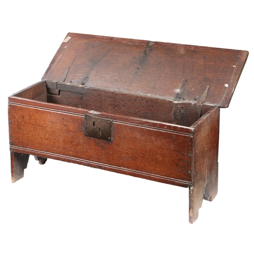 198 - A MID-17TH CENTURY OAK BOARDED CHEST, CIRCA 1630-60. Constructed from single-piece boards, the lid a... 