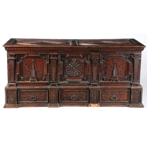 2 - A GOOD MID-17TH CENTURY PINE/CEDAR CHEST, ORNATELY CARVED, STAINED AND DATED 1648. Of show dove-tail... 