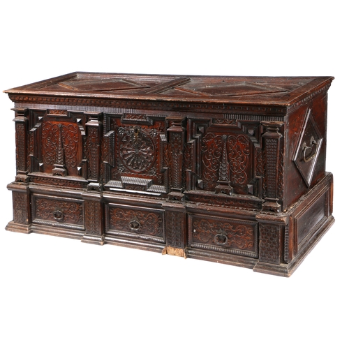 2 - A GOOD MID-17TH CENTURY PINE/CEDAR CHEST, ORNATELY CARVED, STAINED AND DATED 1648. Of show dove-tail... 