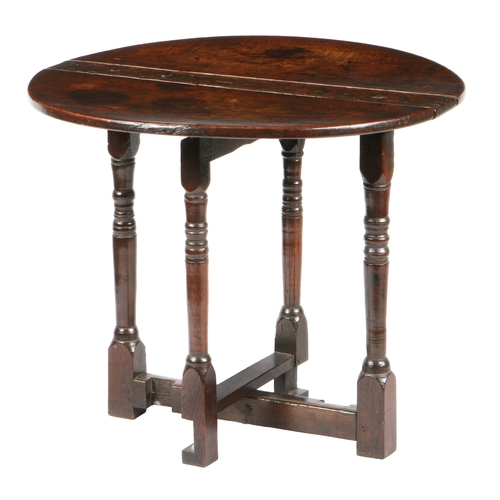 202 - A RARE AND UNUSUAL 17TH CENTURY OAK DROP LEAF COACHING TABLE. having a slender rectangular top above... 