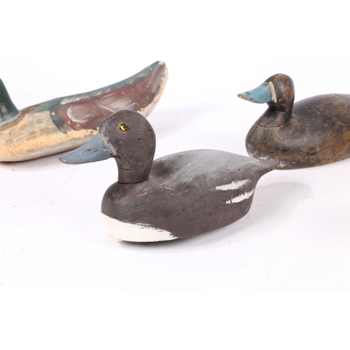 212 - FIVE POLYCHROME-DECORATED DECOY DUCKS. Each of typical naturalistic form, with coloured bill, two wi... 