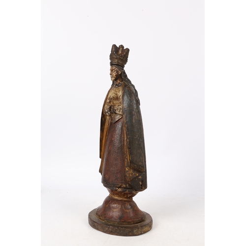 215 - A LATE 18TH CENTURY SPANISH COLONIAL POLYCHROME CARVED WOODEN FIGURE. crowned figure with a cape and... 