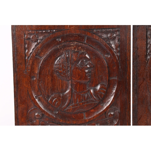 218 - A PAIR OF MID-16TH CENTURY OAK ROMAYNE-TYPE PORTRAIT PANELS, CIRCA 1540-60. One designed with a male... 