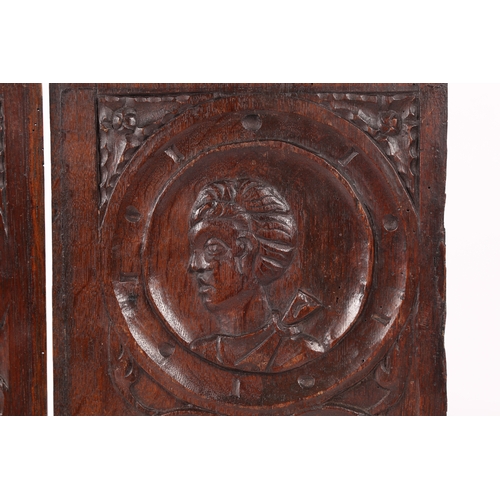 218 - A PAIR OF MID-16TH CENTURY OAK ROMAYNE-TYPE PORTRAIT PANELS, CIRCA 1540-60. One designed with a male... 