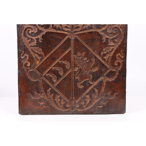 219 - A RARE 17TH CENTURY LEATHER-WORK ARMORIAL PANEL, ENGLISH. The cut-leather mounted on pine boards, de... 