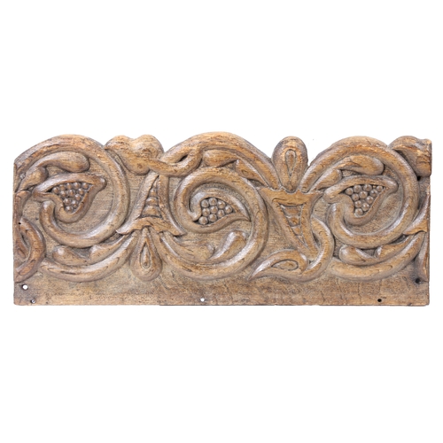 223 - A PAIR OF CARVED OAK FRIEZE PANELS, CIRCA 1600. Each designed with scrolling stylized fruiting vine ... 