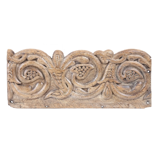 223 - A PAIR OF CARVED OAK FRIEZE PANELS, CIRCA 1600. Each designed with scrolling stylized fruiting vine ... 