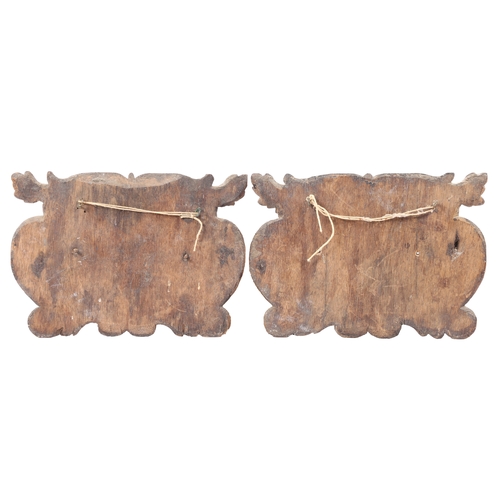 224 - A PAIR OF MID-17TH CENTURY CARVED OAK PANELS, CIRCA 1640. Each designed as a dolphin, framed within ... 