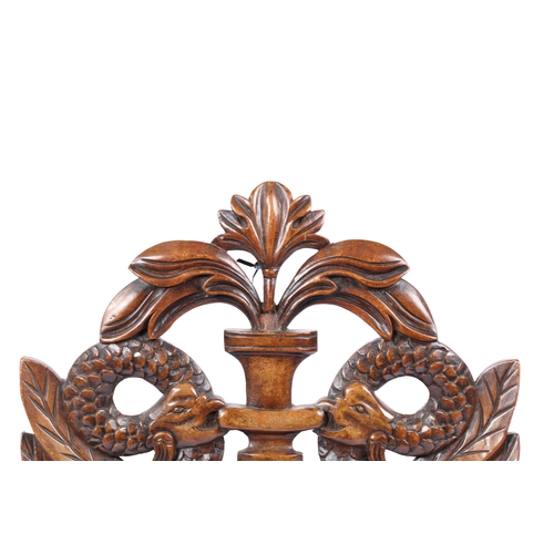 228 - A LARGE MAHOGANY PIERCED AND CARVED CRESTING PANEL, CIRCA 1830. Designed with paired cockatrice, cen... 