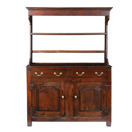 23 - AN 18TH CENTURY OAK DRESSER BASE. with a stepped pediment above two shelves raised on two drawers wi... 