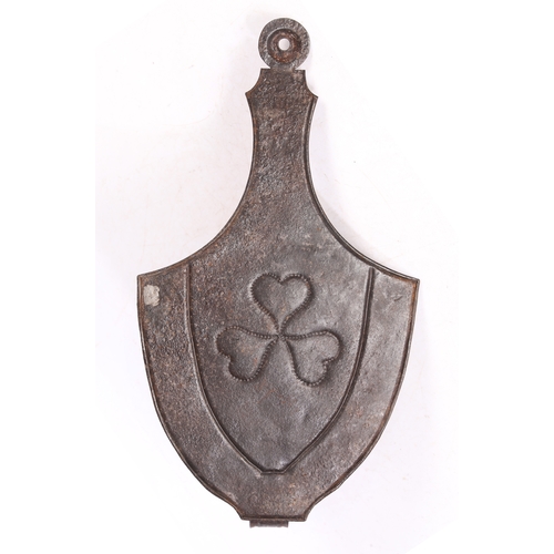 232 - A SHEET IRON WALL SCONCE, CIRCA 1820-50. The urn-shaped backplate centred by a repouseé triple-heart... 