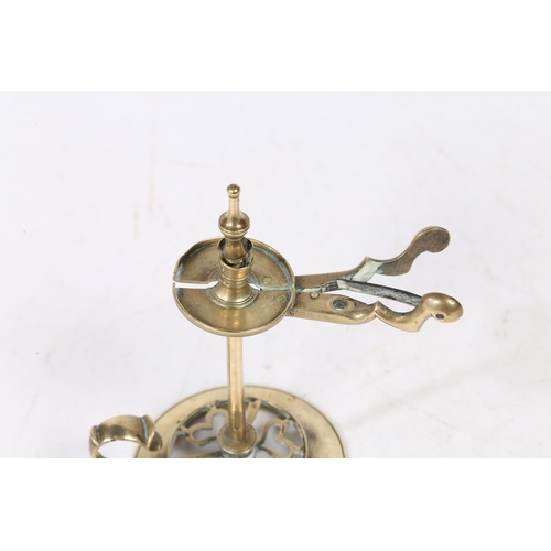 235 - A GEORGE III BRASS WAX JACK. with scissor handles to the sprung wax holder above a stem and a heart ... 