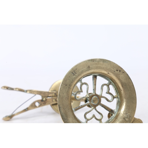 235 - A GEORGE III BRASS WAX JACK. with scissor handles to the sprung wax holder above a stem and a heart ... 