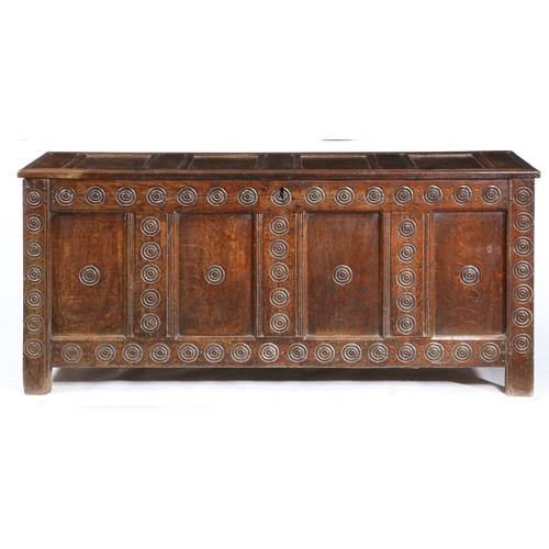 3 - A 17TH CENTURY OAK COFFER, WELSH, PROBABLY MONMOUTHSHIRE, CIRCA 1640-60. The lid of four panels with... 