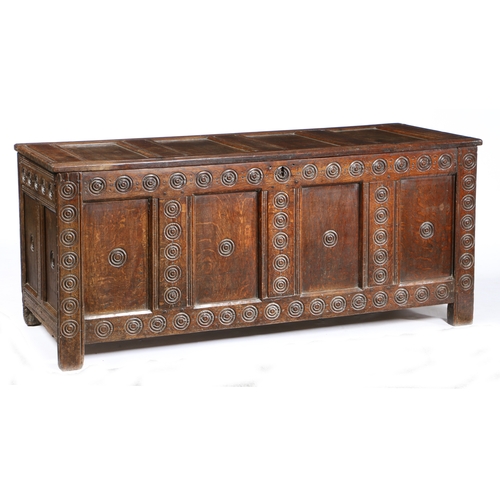3 - A 17TH CENTURY OAK COFFER, WELSH, PROBABLY MONMOUTHSHIRE, CIRCA 1640-60. The lid of four panels with... 