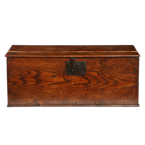 30 - AN EARLY 18TH CENTURY STAINED PINE BOARDED CHEST. Of simple form, with iron lockplate and hasp, 81cm... 