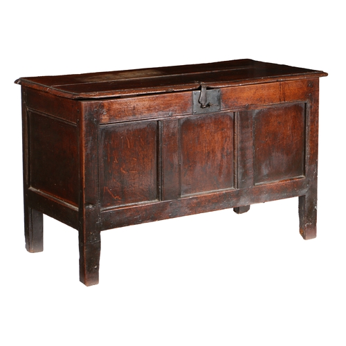33 - A CHARLES II OAK COFFER, CIRCA 1660. Having a twin-boarded lid with ovolo-moulded edge, the front wi... 