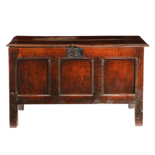 33 - A CHARLES II OAK COFFER, CIRCA 1660. Having a twin-boarded lid with ovolo-moulded edge, the front wi... 