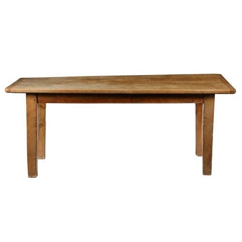 40 - A 19TH CENTURY SYCAMORE FARMHOUSE TABLE. The long twin plank rectangular top with cleated ends above... 