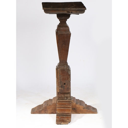 42 - AN OAK PEDESTAL/TORCHÈRE STAND, TIMBERS CIRCA 1500-50 AND LATER. The square top with stepped undersi... 