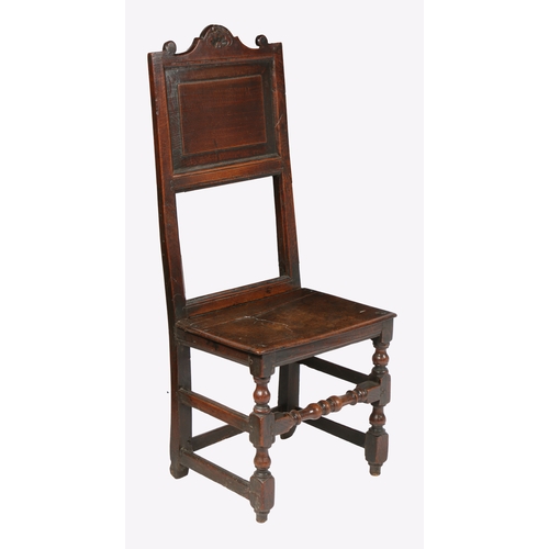43 - AN UNUSUAL CHARLES II OAK BACKSTOOL, NORTH COUNTRY, CIRCA 1680. The tall and slender back with field... 