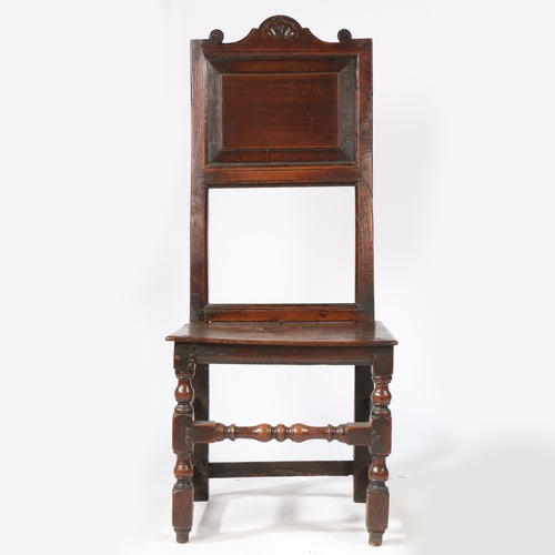 43 - AN UNUSUAL CHARLES II OAK BACKSTOOL, NORTH COUNTRY, CIRCA 1680. The tall and slender back with field... 