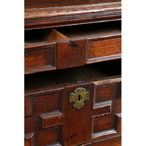 44 - A CHARLES II OAK GEOMETIRC CHEST OF DRAWERS, CIRCA 1660. The rectangular top above four long moulded... 