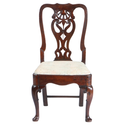 454 - A GEORGE II OAK SIDE CHAIR, CIRCA 1740. Having a vaseoid pierced splat, serpentine cresting and shap... 