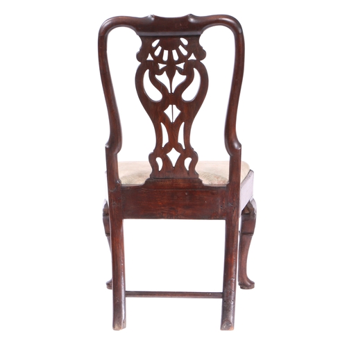 454 - A GEORGE II OAK SIDE CHAIR, CIRCA 1740. Having a vaseoid pierced splat, serpentine cresting and shap... 