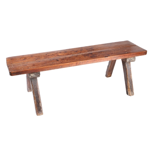 51 - A 19TH CENTURY ELM PIG BENCH. the rectangular two plank top above four angled chamfered legs, 141cm ... 
